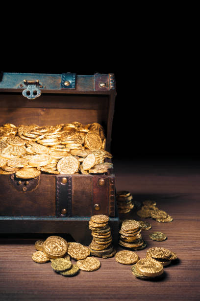 istock Treasure chest filled with gold coins 1007461382