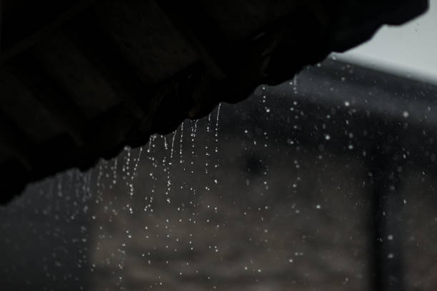Circular rain drops from shelter in rainy season,