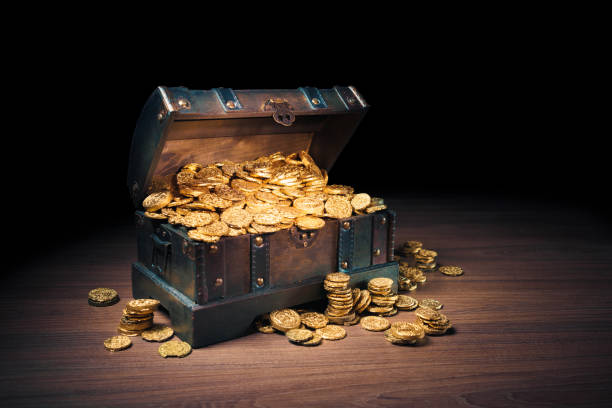 istock Treasure chest filled with gold coins 1007461506