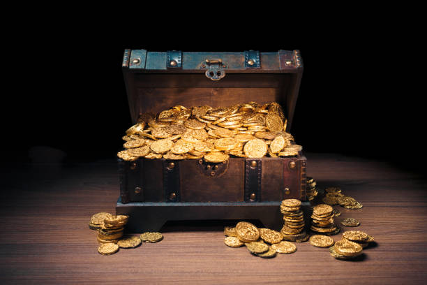istock Treasure chest filled with gold coins 1007461544