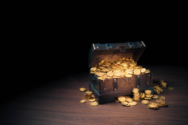 istock Treasure chest filled with gold coins 1007461660