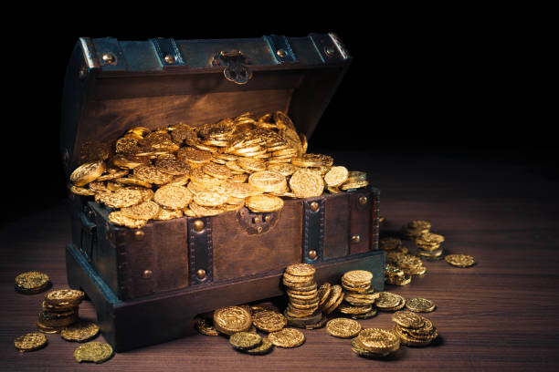 istock Treasure chest filled with gold coins 1007461708