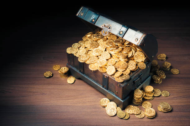 istock Treasure chest filled with gold coins 1007461754