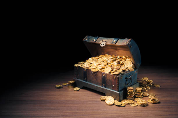 istock Treasure chest filled with gold coins 1007461848