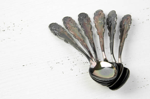 istock Vintage metal coffee spoons on white background. 1007464168