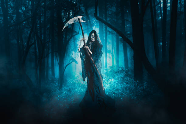 istock Grim reaper with a scythe in the woods 1007467818