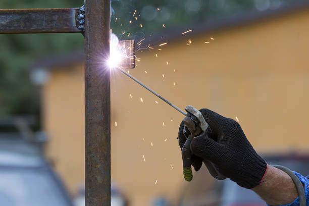 man welder working - brass instrument flash imagens e fotografias de stock