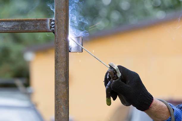 man welder working - brass instrument flash imagens e fotografias de stock