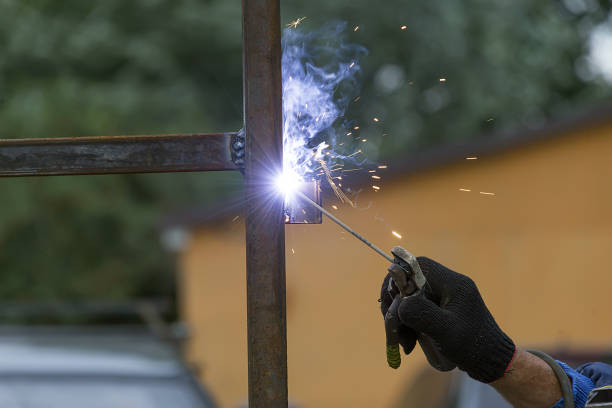 man welder working - brass instrument flash imagens e fotografias de stock