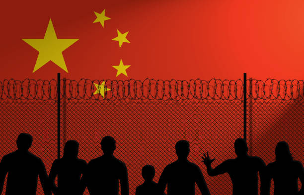 Chinese Flag Behind Secure Fence stock photo