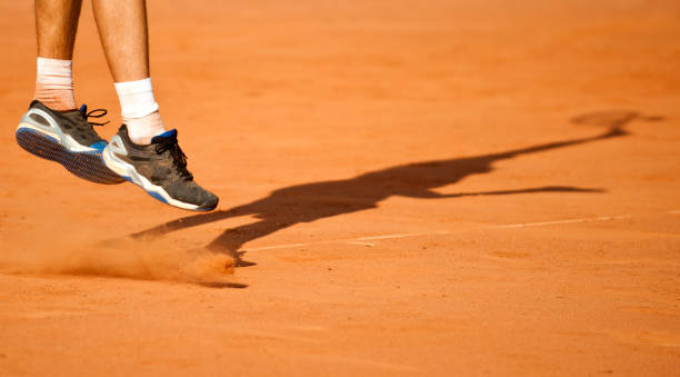 istock The tennis player puts the ball 1007473990