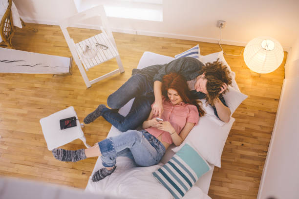 istock Beautiful couple in bed relaxing 1007485292