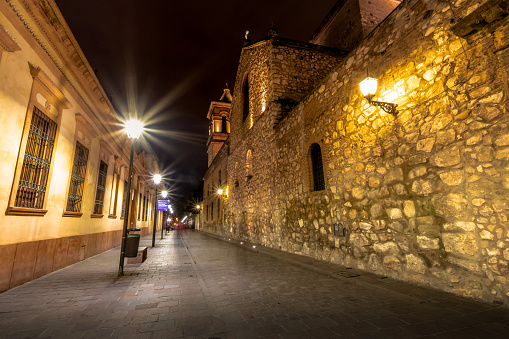 Bloque de Manzana Jesuitica y la iglesia jesuita de la compañía de Jesús (Iglesia de la Compania de Jesus) en la noche - Córdoba, Argentina photo