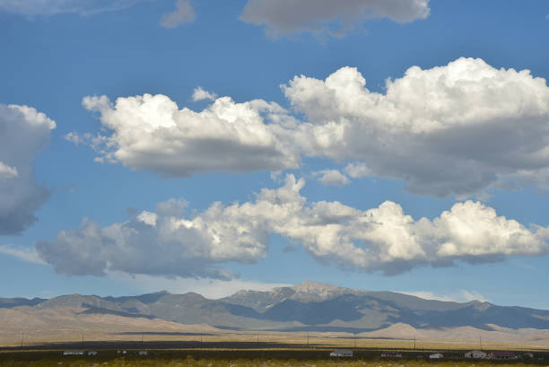 istock clouds over the Spring Mountains in the Mojave Desert, Pahrump, Nevada, USA 1007491640
