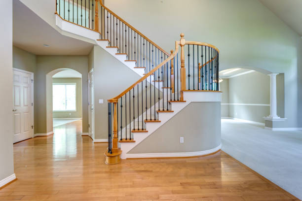 istock Chic foyer with traditional staircase. 1007495940
