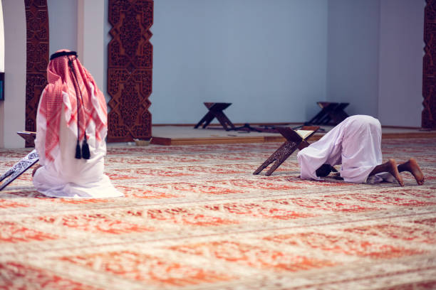 istock Two Religious muslim man praying inside the mosque 1007498100