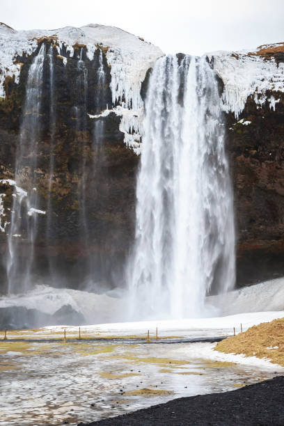 istock Big Seljalandsfoss waterfalls in snowy Winter Iceland 1007511368