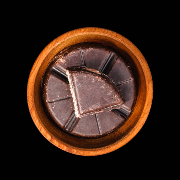 Traditional mexican chocolate bar in wooden bowl