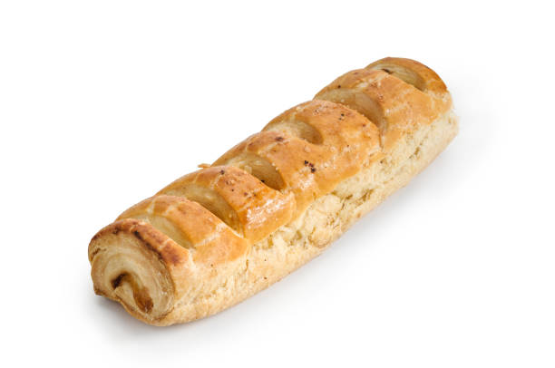 Puff pastry roll with pineapple filling, sweet bread traditional Mexican bakery isolated on white background