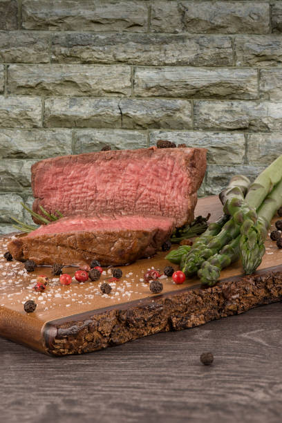 istock Close up on fillet mignon with asparagus on the side. 1007514228