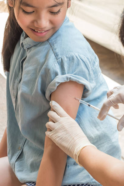 Immunization and vaccination for polio prevention for young child girl
