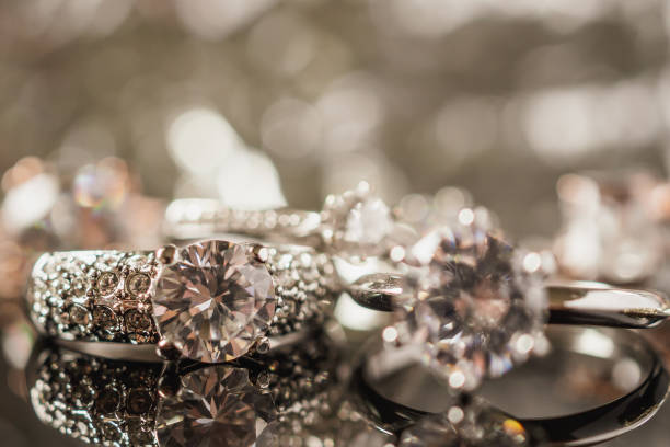 istock Luxury Jewelry diamond rings with reflection on black background 1007524928