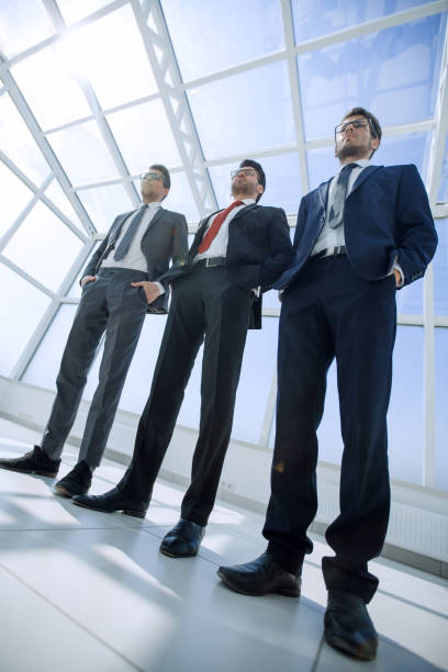 istock three business partners standing next to each other 1007530500