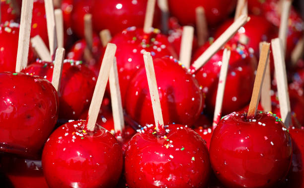 istock Delicious candy apples covered with colorful sprinkles 1007532666