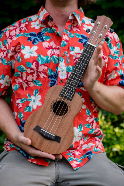 istock man with hawaiian shirt and ukulele 1007543002