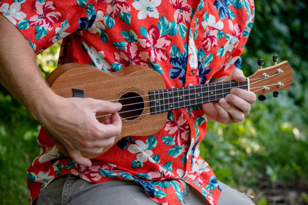 istock man with hawaiian shirt and ukulele 1007543010