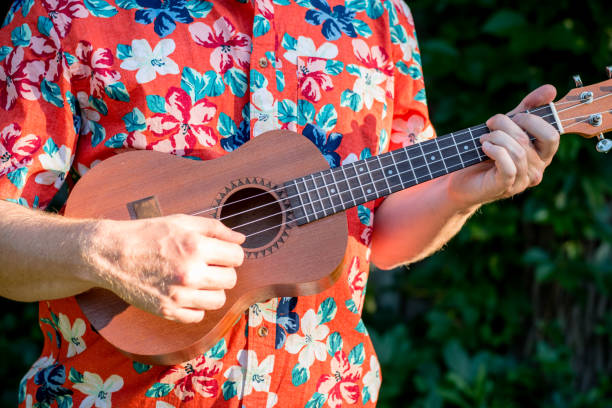 istock man with hawaiian shirt and ukulele 1007543048