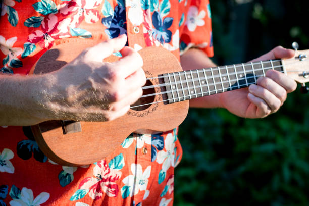 istock man with hawaiian shirt and ukulele 1007543058
