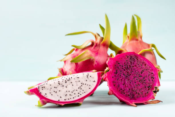 istock Half and slice dragon fruit on color background 1007548934