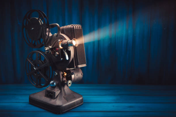 istock Film projector on wooden background 1007557218