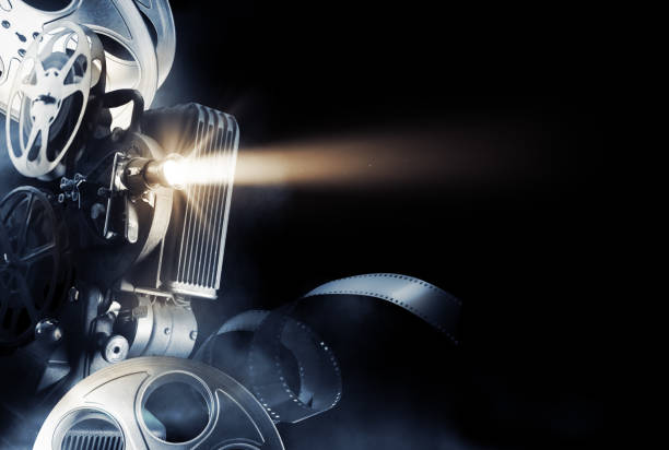 istock Movie projector on movie background 1007558706