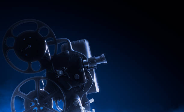 istock Movie projector on dark background 1007559284