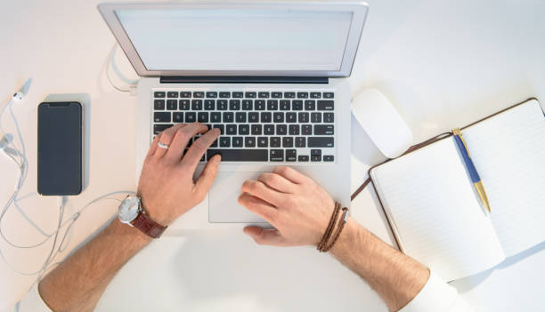 istock Table top view of a person working. 1007568218