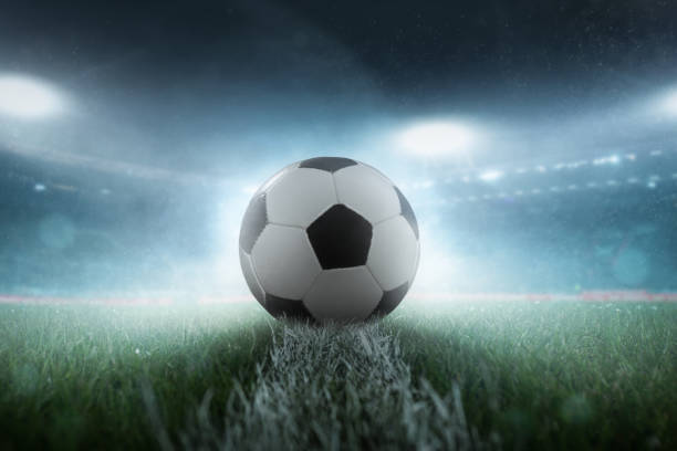 istock Football on the stadium turf 1007574404