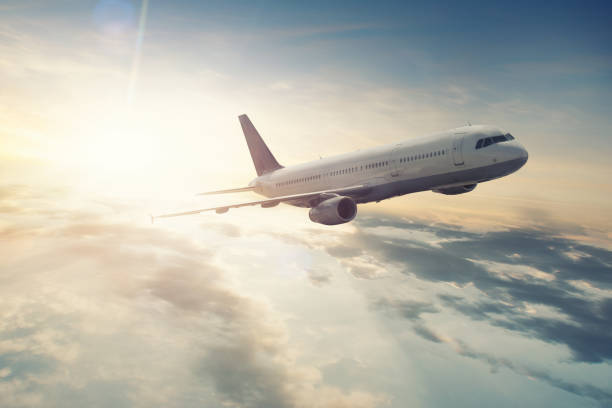 istock Plane flies towards the sun 1007576640