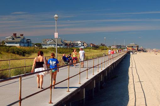 Spring Lake, NJ, USA August 11, 2006 Folks enjoy a summer's day leisurely strolling on the boardwalk in Spring Lake, New Jersey
