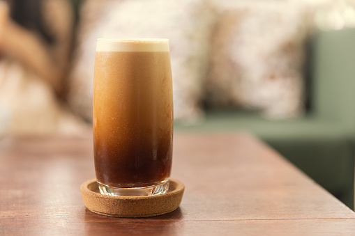 Cold brew or Nitro Coffee drink in the glass with bubble foam