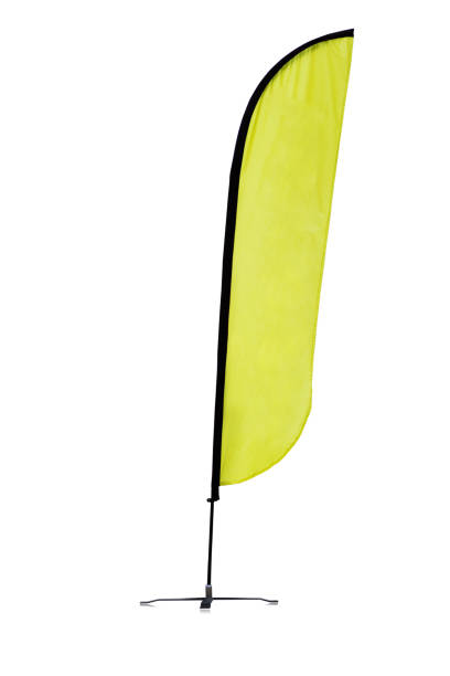 Beach yellow flag Beach yellow flag isolated on white background with clipping path. feather flag stock pictures, royalty-free photos & images