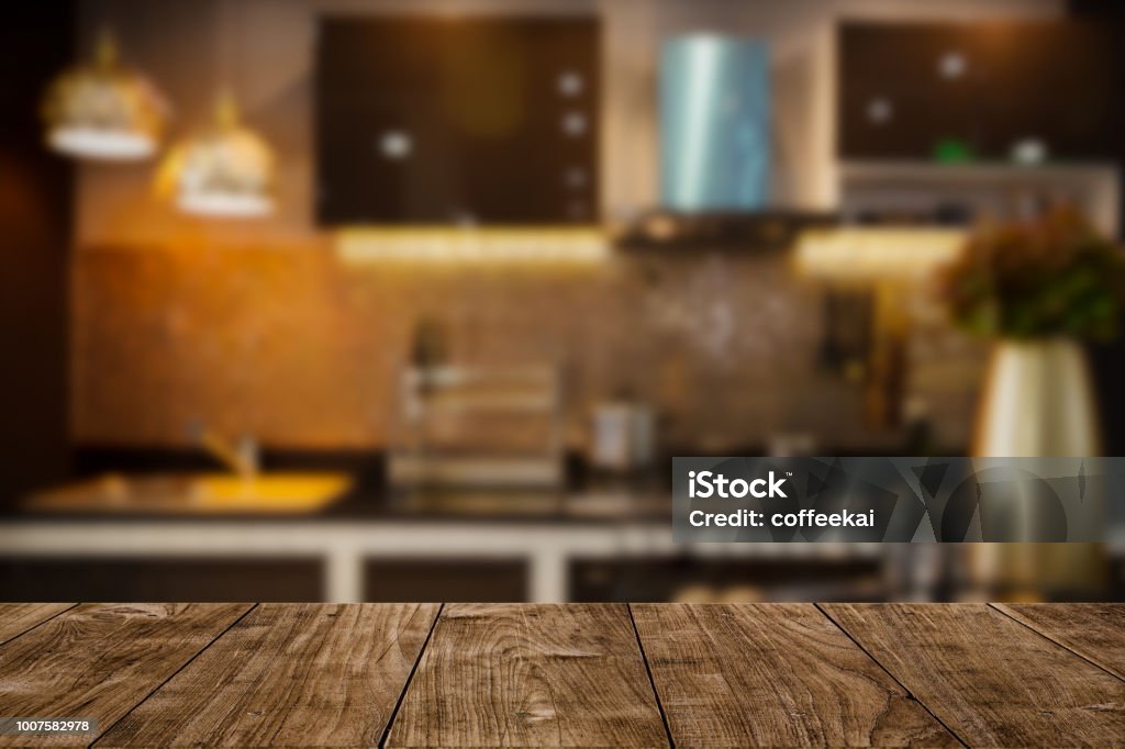 modern luxury kitchen black golden tone with wooden tabletop space for display or montage your products. Kitchen Stock Photo