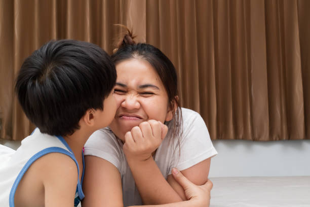 istock Boy is kissing his mom. 1007605134