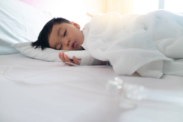 istock Asian patient boy lying at hospital 1007605336