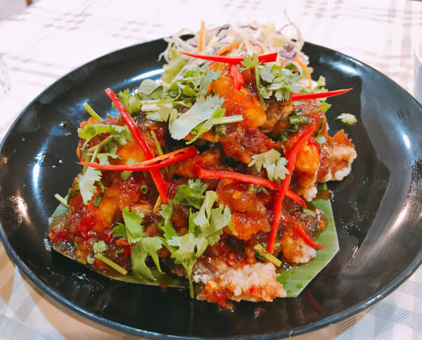 istock Deep fried grouper fish with sweet and sour chili sauce. 1007613000
