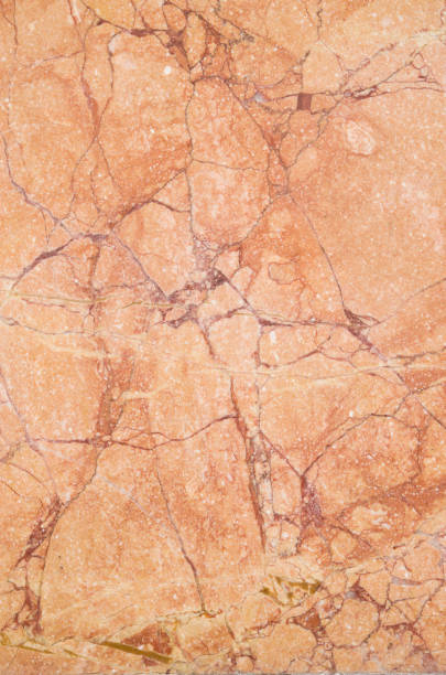 istock Polished cladding colorful marble orange closeup 1007621794