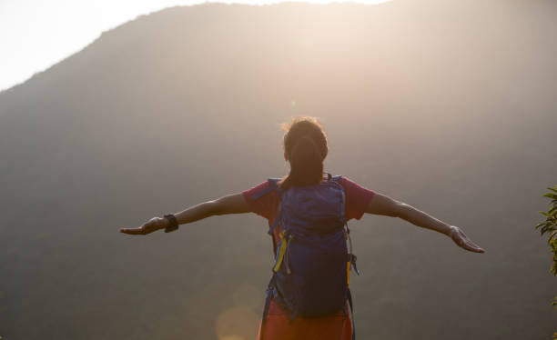 istock successful hiker hiking on summer sunrise mountain top 1007624580