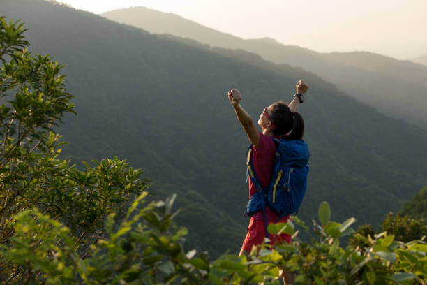 istock successful hiker hiking on summer sunrise mountain top 1007624806