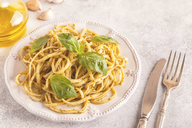 istock Pasta with homemade pesto sauce. 1007624816